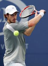 Andy Murray readies to hit a slice backhand.jpg