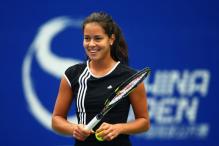 Ana Ivanovic smiles during practice for the China Open 2008.jpg