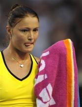 Dinara Safina sticks out her tongue about to towel off.jpg