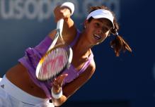 anna ivanovic serve follow-through.jpg