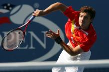 ernests gulbis serve follow through.jpg