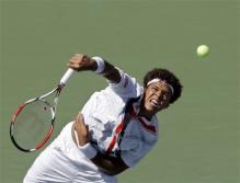 jo-wilfried tsonga serve follow-through.jpg