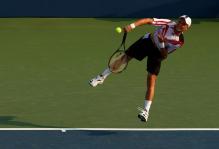 nikolay davydenko serve follow-through 2.jpg