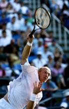 nikolay davydenko serve follow-through.jpg