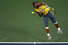 rafael nadal serve follow-through.jpg