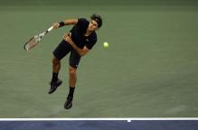 roger federer serve follow through.jpg