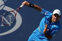 stanislas wawrinka serve follow through.jpg