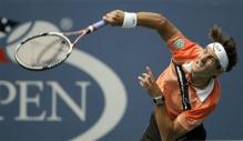 tommy robredo serve follow through.jpg